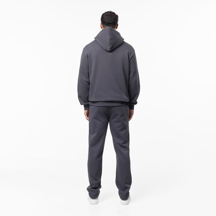 Full side view of relaxed fit tracksuit in dark grey