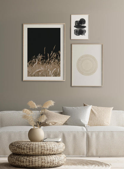 "A Night in the Field" is a botanical photography poster by Opposite Wall of wispy beige grasses under a pitch black night sky.