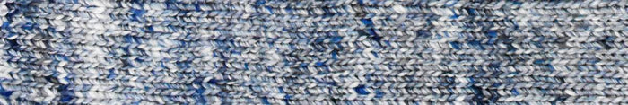 Close up of knitted fabric using Noro yarn in Ruri color; Shade in combinations of light blue, dark blue, and white