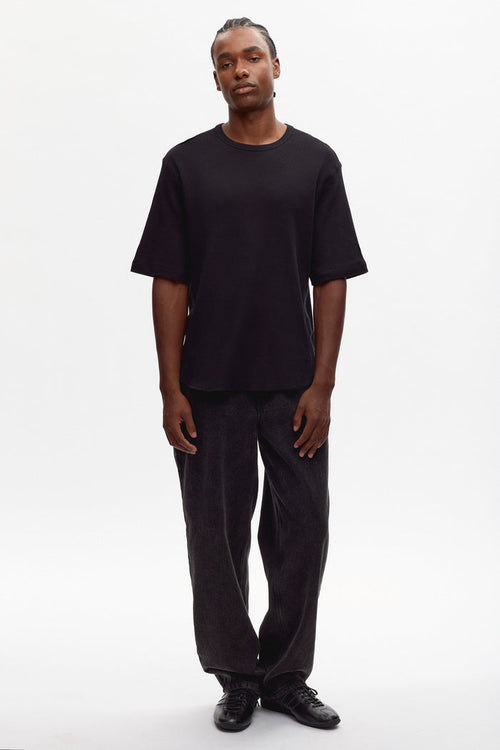 Justus is 6'1" is a regular L, and is wearing an L.
