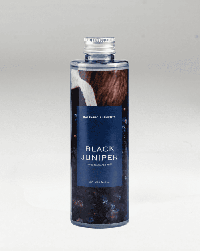 A 200ml bottle of Balearic Elements Black Juniper Home Fragrance Refill, featuring a dark blue label with white text and a silver cap, set against a neutral gray background.