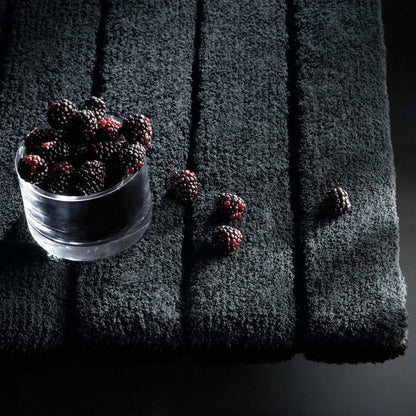 Bamboo Graphite Stripe Bath Mat - 100% bamboo bath mat featuring a dark grey carved stripe pattern.