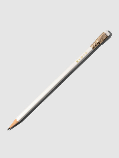 White wooden pencil displayed on a neutral background.