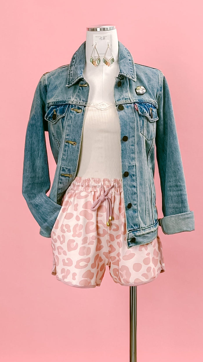 Mannequin wearing a denim jacket, a soft powder Babette silk cotton lace trimmed tank top, and blush pink leopard-print shorts. Shop at www.thehouseofblondie.com