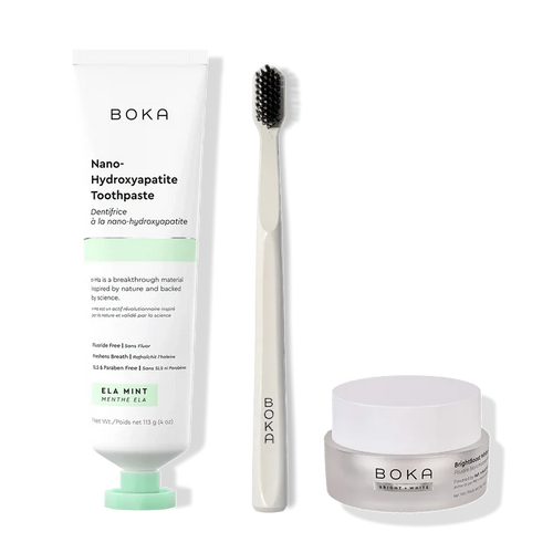 Boka toothpaste, toothbrush, and whitening powder on a white background