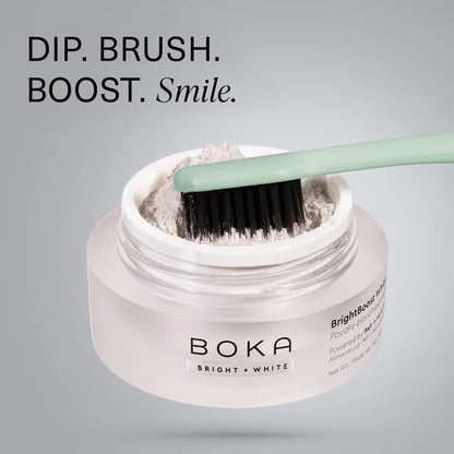 Boka Bright White powder with a brush on a gray background