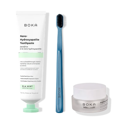 Boka toothpaste, toothbrush, and whitening powder on a white background
