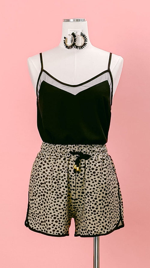 Mannequin wearing a black mesh-trimmed camisole, and taupe-and-black leopard-print shorts. Shop at www.thehouseofblondie.com