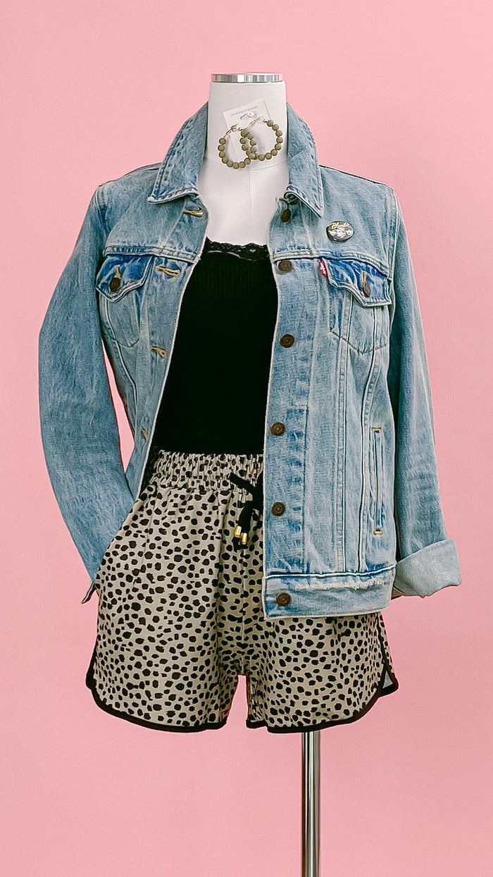 Mannequin wearing a denim jacket, a black mesh-trimmed camisole, and taupe-and-black leopard-print shorts. Shop at www.thehouseofblondie.com