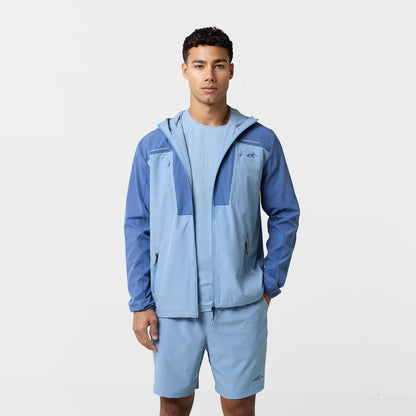 The model is wearing the light blue tri-set with two toned windbreaker, tshirt and matching shorts