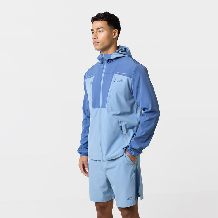 Side profile of the light blue tri-set with pockets, colour block sleeves and matching shorts