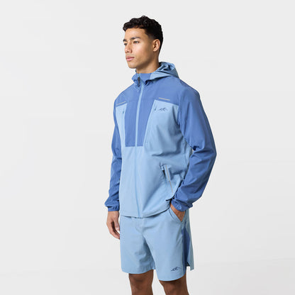 Side profile of the light blue tri-set with pockets, colour block sleeves and matching shorts