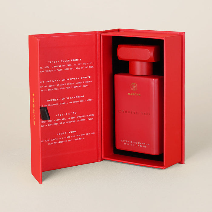 Front view of Craving You perfume in red gift box showing rectangular bottle with matching cap and printed message
