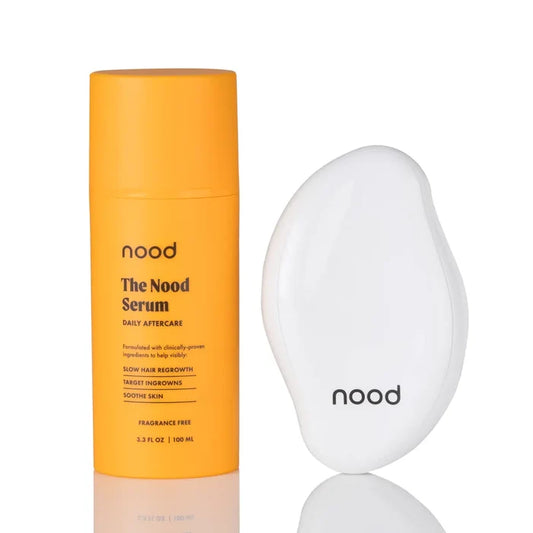 Nood Erase Kit bundle including Nood Serum daily aftercare and white Eraser exfoliating hair removal tool on white background