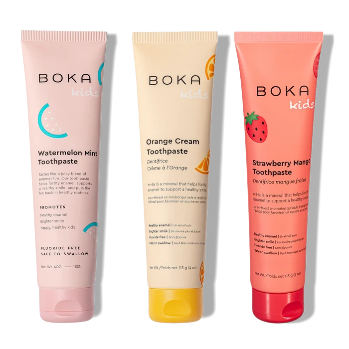 Three tubes of Boka toothpaste in different flavors on a white background