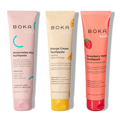 Three tubes of Boka toothpaste in different flavors on a white background