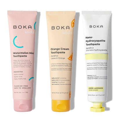 Three Boka toothpaste tubes on a white background