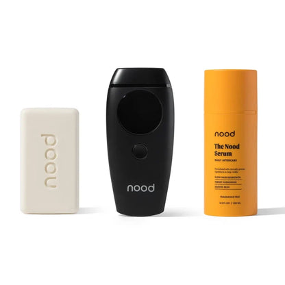 Nood Flasher 2.0 Kit in black including Buff Bar soap, Flasher 2.0 IPL device in matte black, and Nood Serum daily aftercare on white background