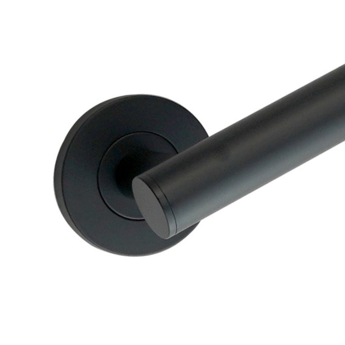 A close up of a matt black bathroom grab bar with round back plate.