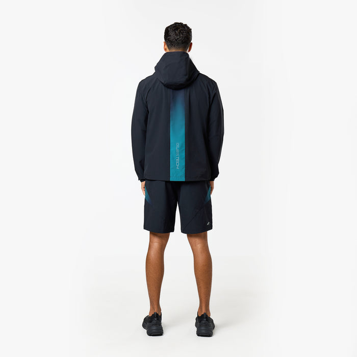 Model shows the gradient stripe on the back of the closure black and teal windbreaker and shorts