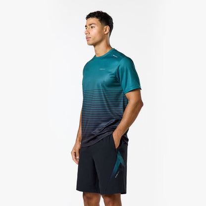 Model is wearing a teal t-shirt with black gradient stripes and matching black shorts from the closure tri-set