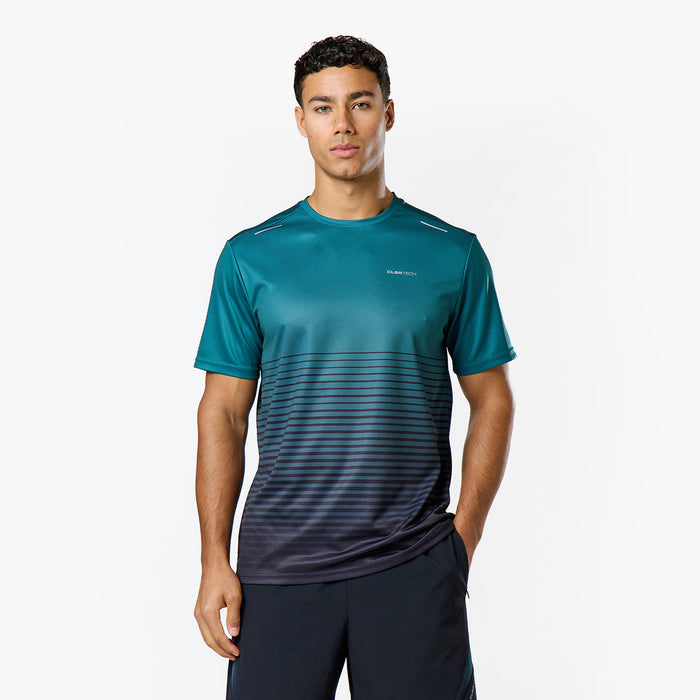 The model is wearing closures technical teal and black gradient technical tshirt from the tri-set
