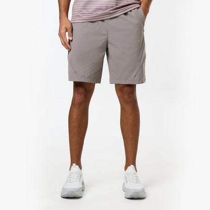 Model wears light grey shorts with details on the side from the Closure tri-set
