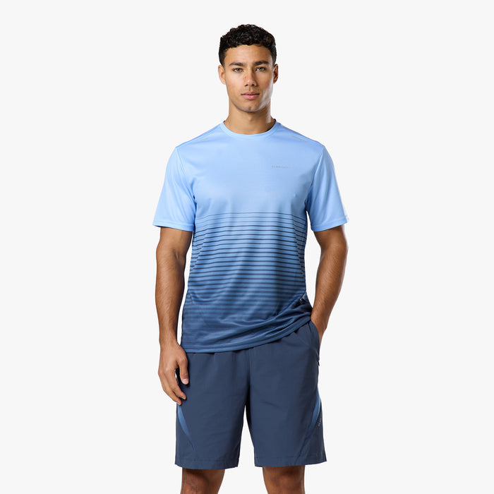 Model wears the light blue and navy gradient top and matching navy shots from Closure tri-set