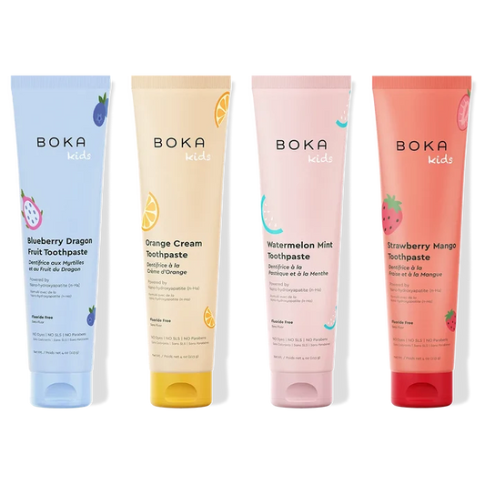 Four Boka Kids toothpaste tubes in different flavors on a white background