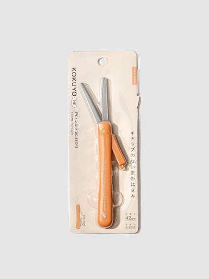 Kokuyo ME Portable Scissors, Kurumi Brown, Cloth and Paper. Scissors displayed in their packaging.