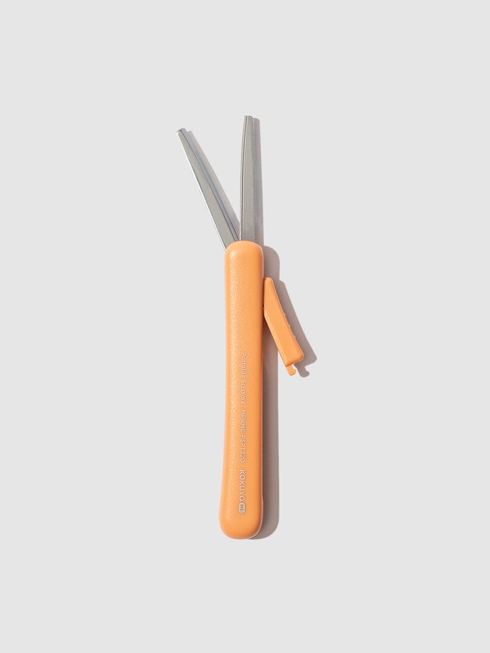 Scissors with blade exposed, displayed on a neutral background. Color shown is Kurumi Brown.
