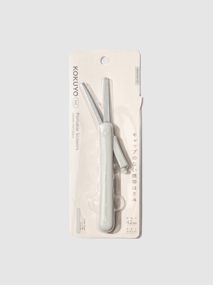 Scissors displayed in their packaging. Color shown is grayish ice.