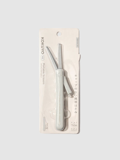 Scissors displayed in their packaging. Color shown is grayish ice.