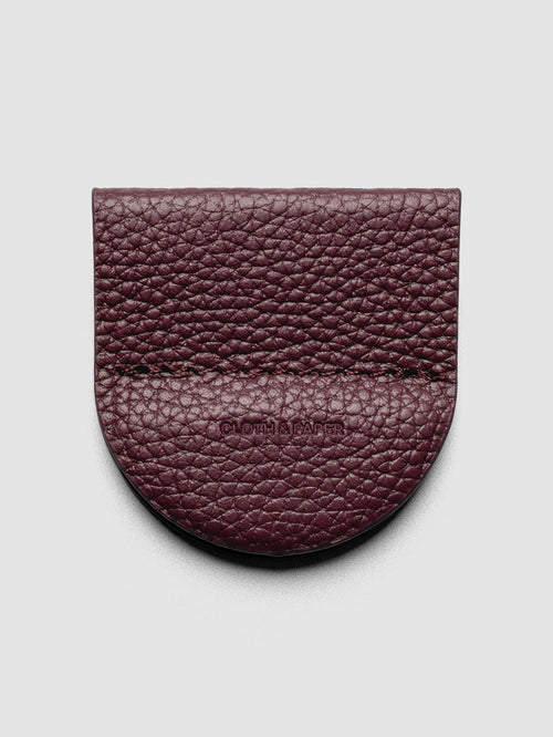 Image shows the Magnetic Bookmark | Pen Holder in Bordeaux, a deep red, displayed on a neutral background.