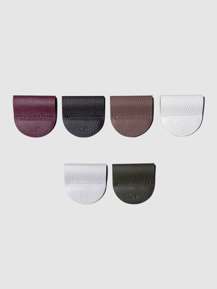 Image shows 6 pen clips in different colors on a white background
