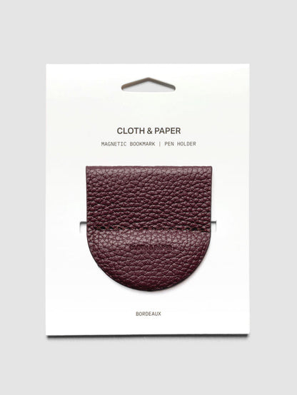 Magnetic Bookmark | Pen Holder in Bordeaux, a deep red, displayed on a white backing card against a neutral background.