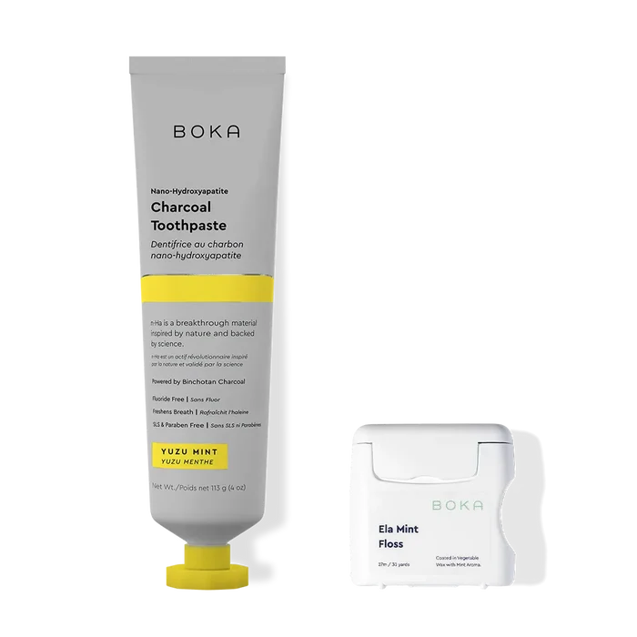 Boka charcoal toothpaste and floss on a white background