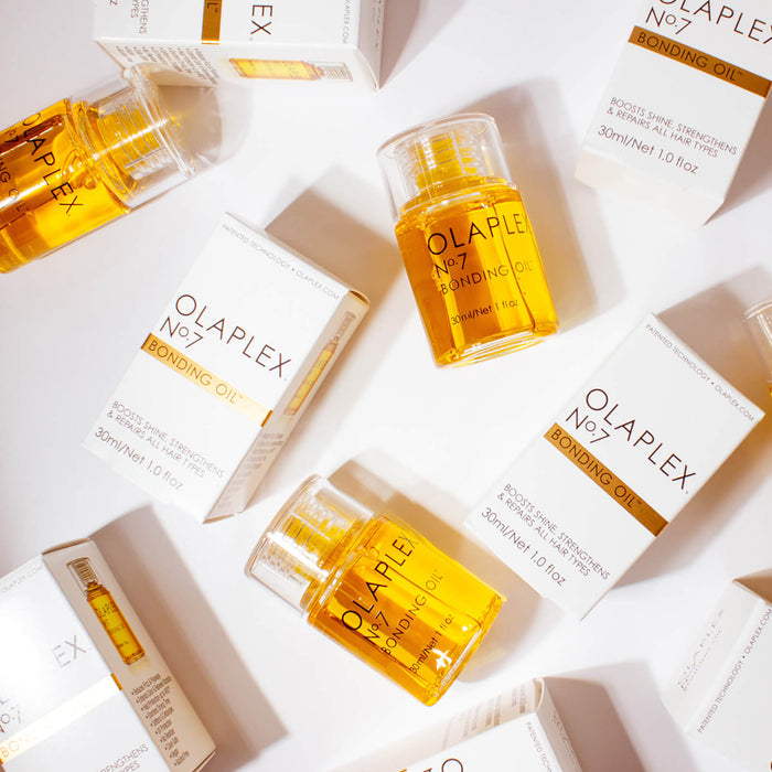 Olaplex No.7 Bonding Oil 30ml for hair care, displaying a sleek bottle with dropper cap, designed to improve hair strength and shine.
