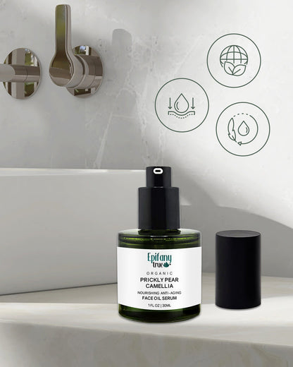 Epifany True Prickly Pear Face Oil open bottle on a bathroom counter with icons indicating ingredients and benefits.