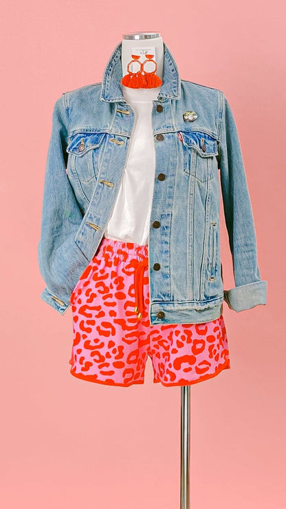 Mannequin wearing a denim jacket and red-and-pink leopard-print shorts against a pink background. Shop the knockabout shorts at www.thehouseofblondie.com