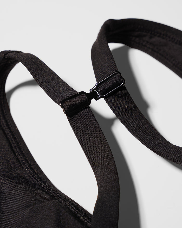 Close up flat lay of the racerback clip on Plungey - Black