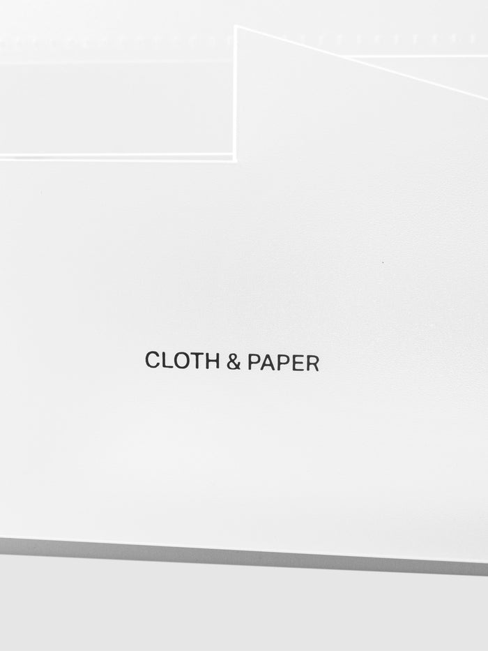Closeup of Cloth and Paper logo printed on caddy.