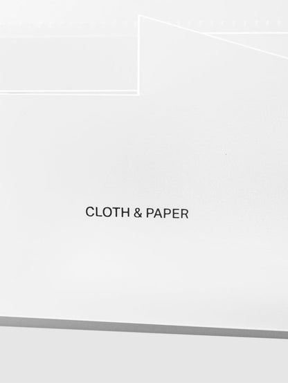 Closeup of Cloth and Paper logo printed on caddy.