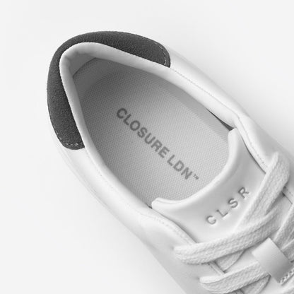 Close-up of the Premium Classic Trainer in White/Grey, highlighting the grey faux suede heel, padded collar and Closure LDN branded insole and tongue.