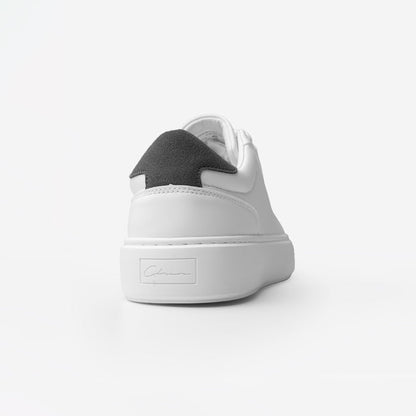 Rear view of the Premium Classic Trainer in White/Grey, highlighting the grey faux suede heel panel and debossed Signature Closure London branding on the white cup sole.