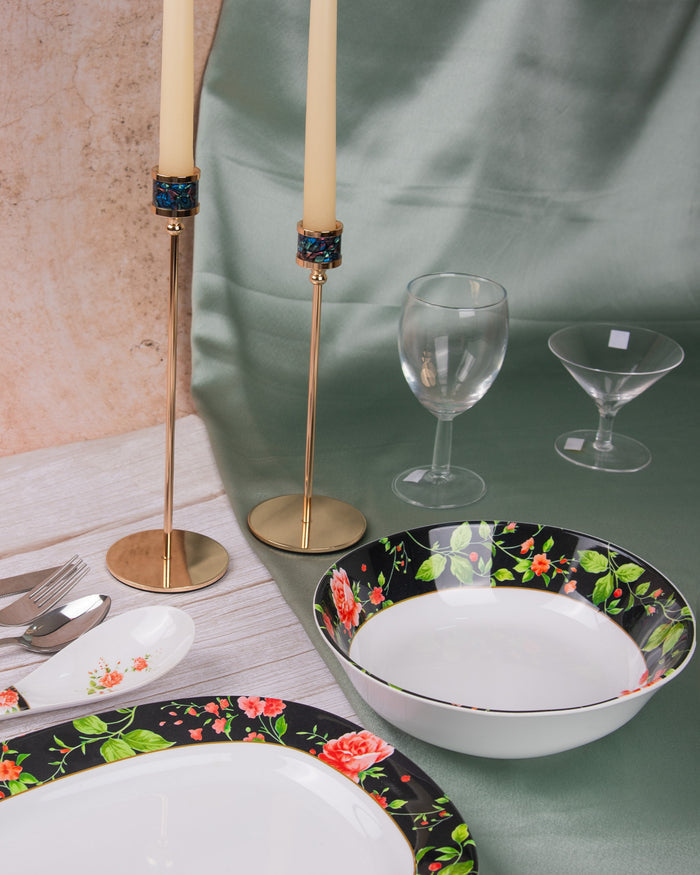 Black floral print melamine serving bowl with white interior