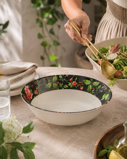 Floral melamine serving bowl on dining table with serving utensils