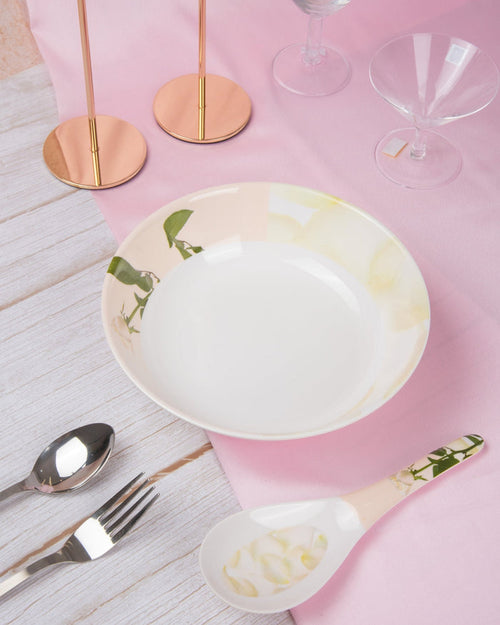 Melamine serving bowl in white with pale rose print, wide rim and shallow shape