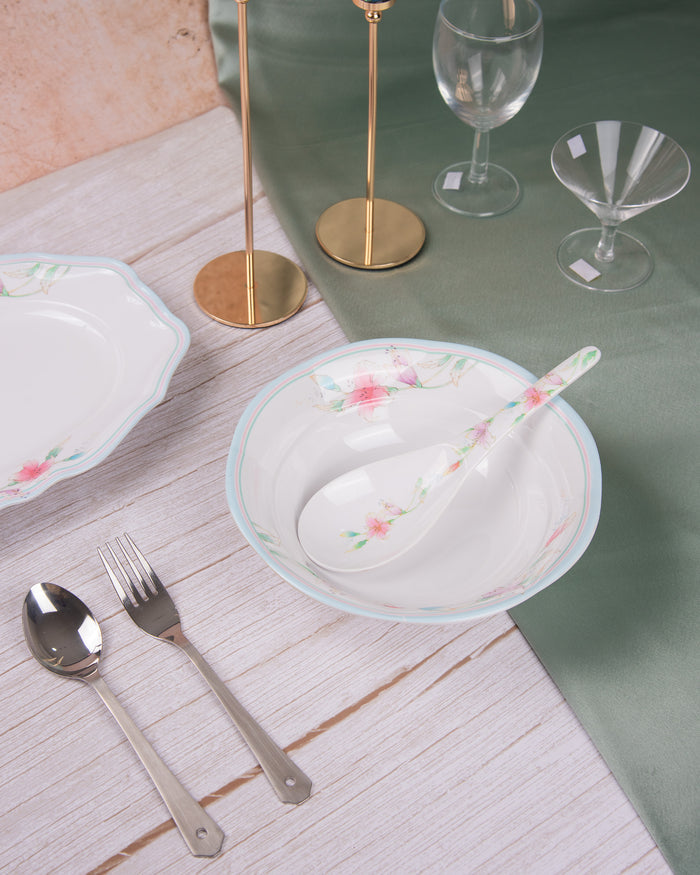 Melamine serving bowl with white base and pink floral print