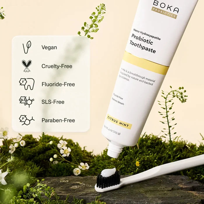 Boka Probiotic Toothpaste with a toothbrush on a natural background